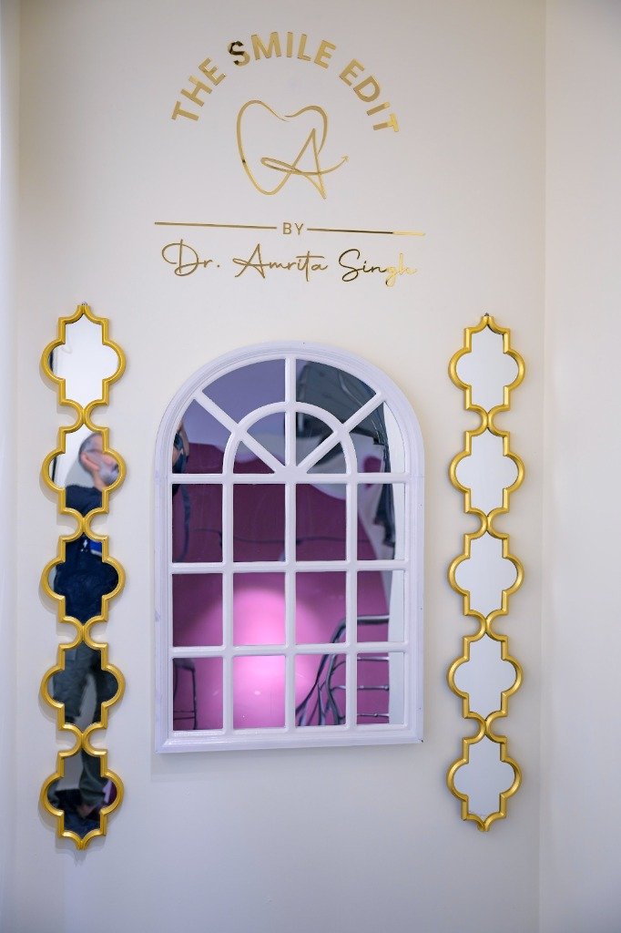 The Smile Edit – Clinic Branding Wall with logo and mirrors